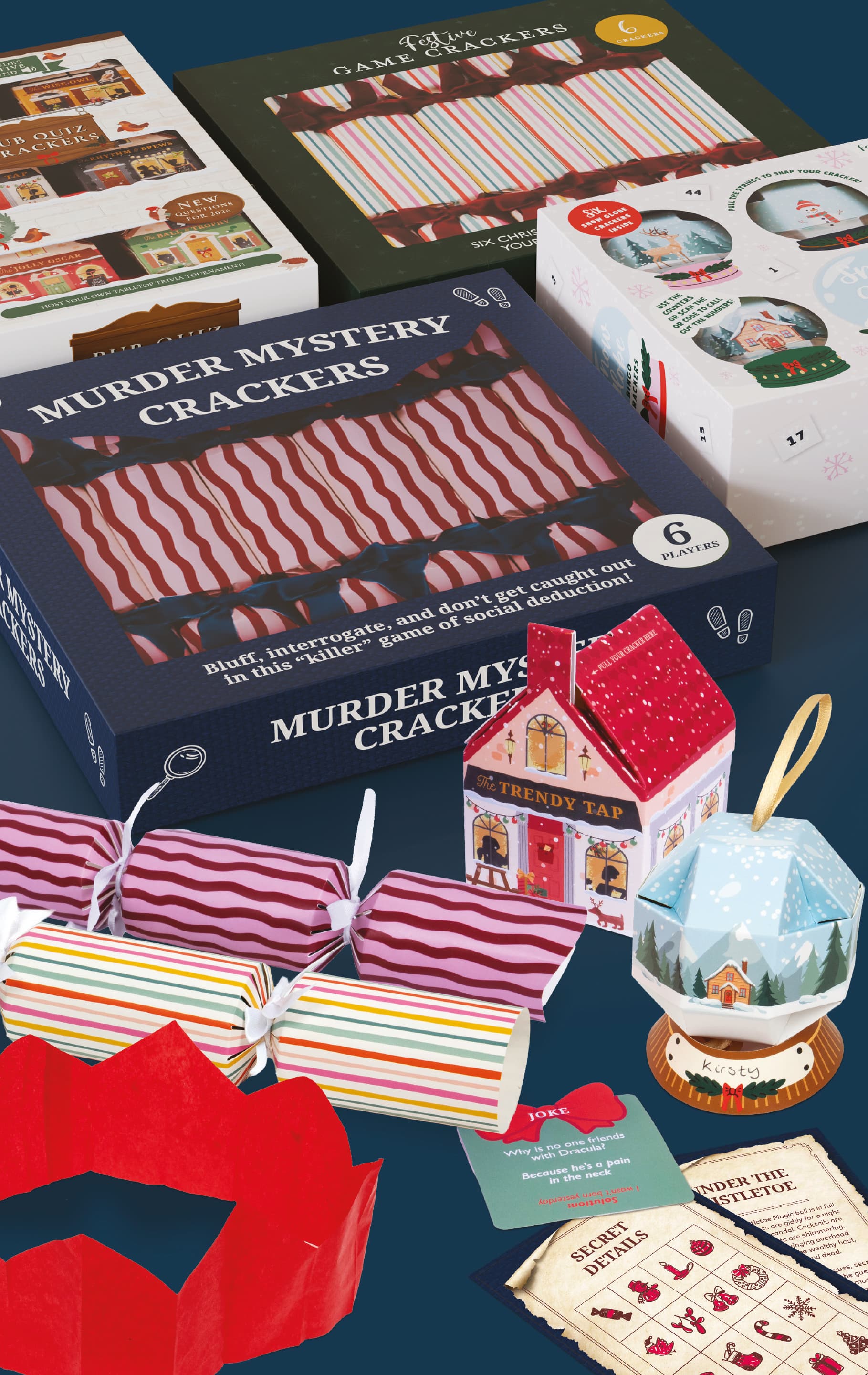 A picture of a box of Christmas Crackers with games and toys around it