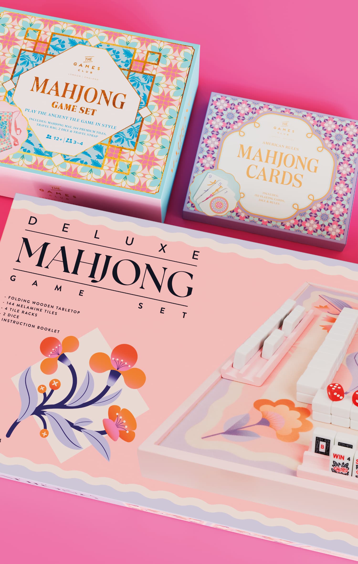 Deluxe Mahjong game sets in pastel packaging, photographed from above