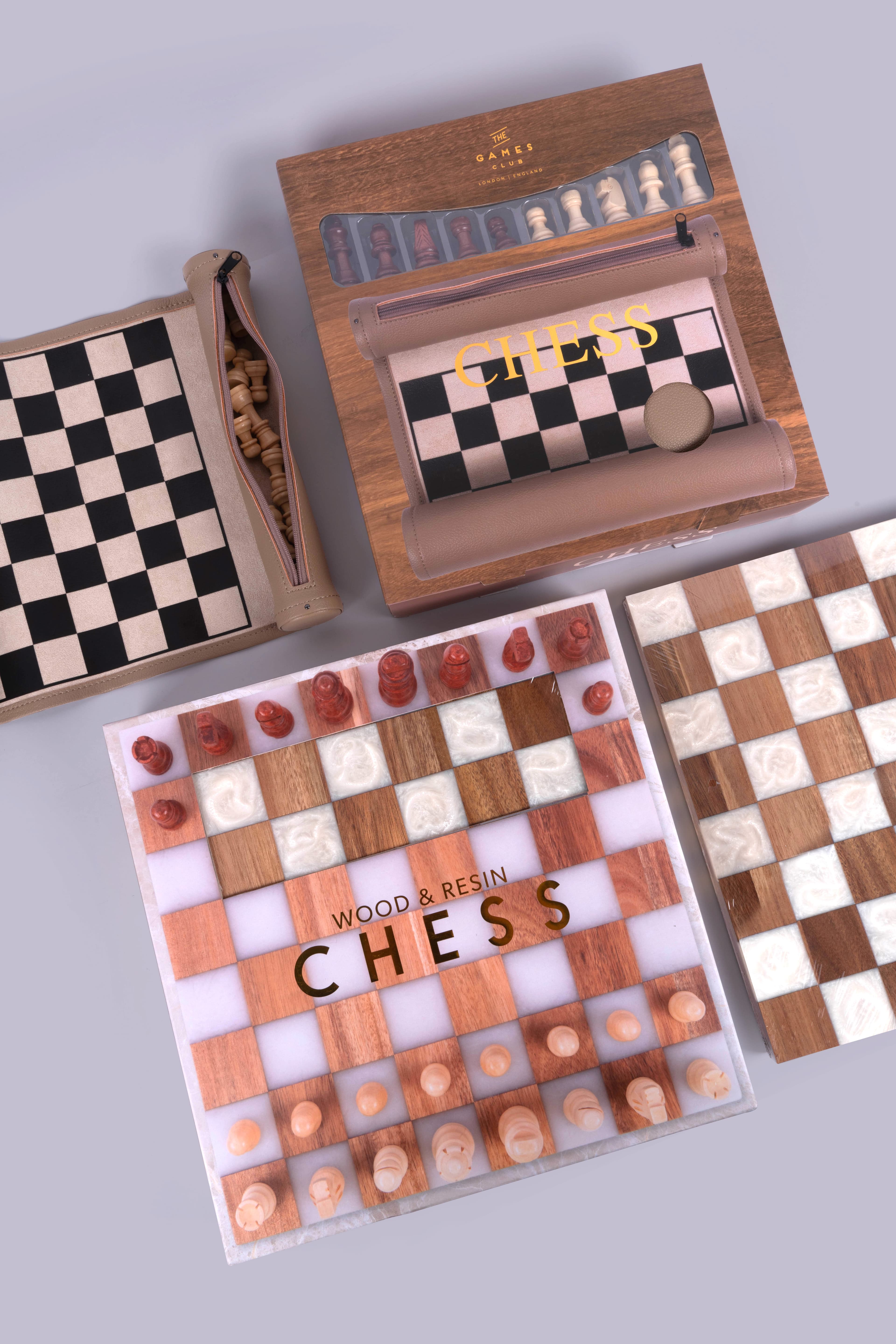 A picture of some traditional games; a chessboard and chess peices